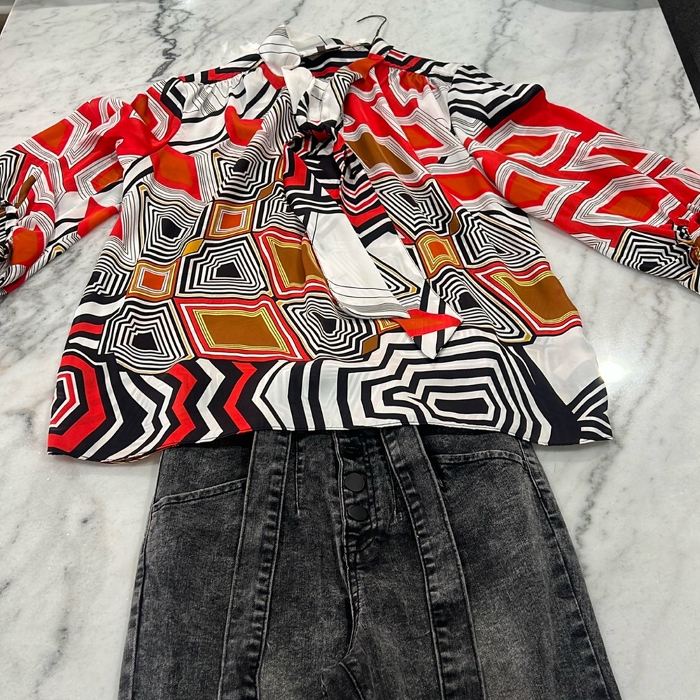 The shirt is by Jennifer Lopez!
